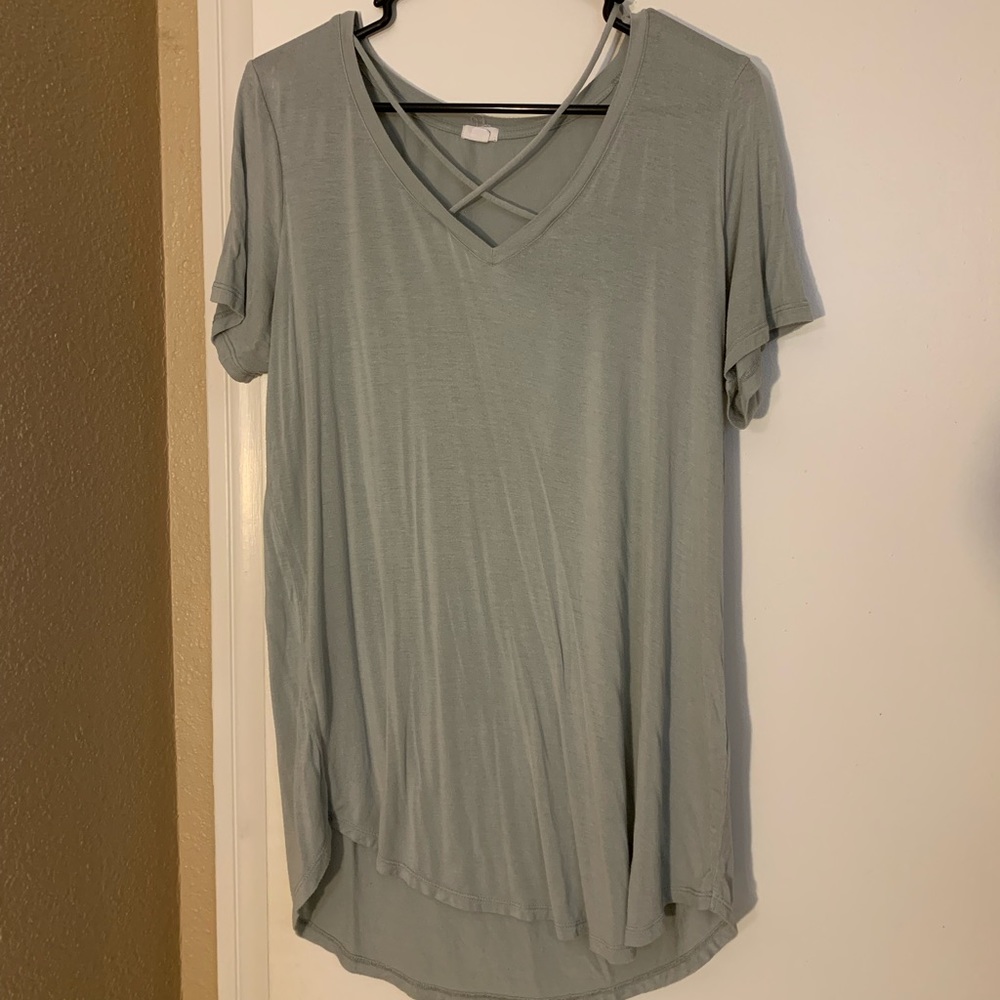 Shirt with cross in front